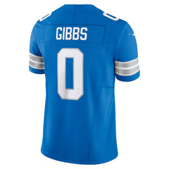 A blue football jersey with the name 'GIBBS' and the number '0' printed on it.