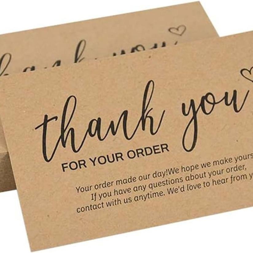 a brown paper card with a handwritten message that says "Thank you for your order".